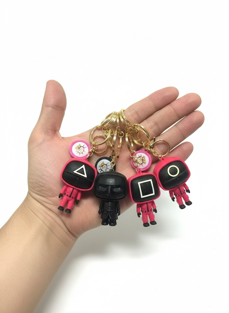 BRELOK SQUID GAME STRAŻNIK (KÓŁKO/KWADRAT/TRÓJKĄT) FIGURKA 3D 6.5 cm